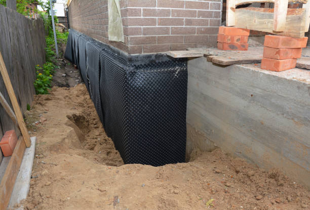 Happy homeowners after waterproofing job in Greendale